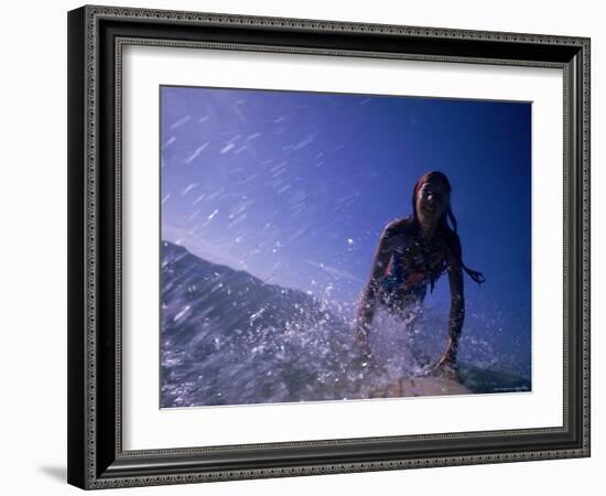 Low Angle View of a Teenage Girl Riding a Surfboard-George Silk-Framed Photographic Print