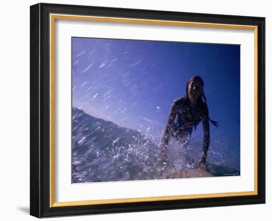 Low Angle View of a Teenage Girl Riding a Surfboard-George Silk-Framed Photographic Print