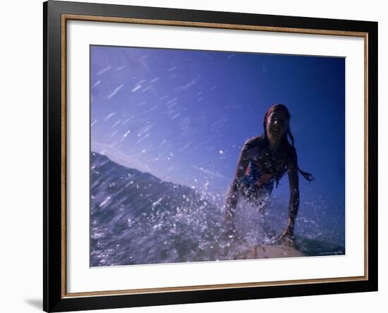 Low Angle View of a Teenage Girl Riding a Surfboard-George Silk-Framed Photographic Print