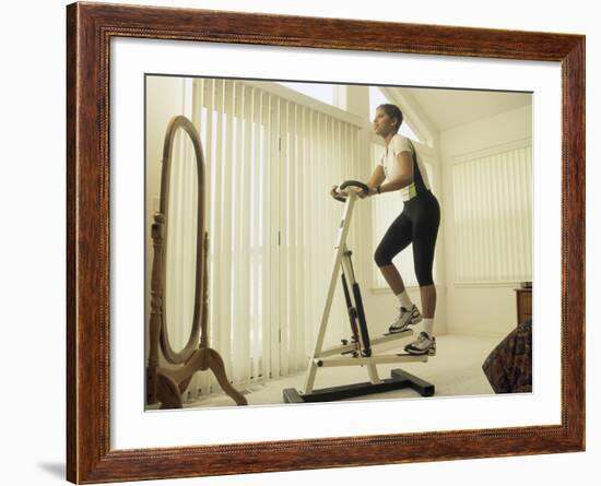 Low Angle View of a Woman Exercising-null-Framed Photographic Print