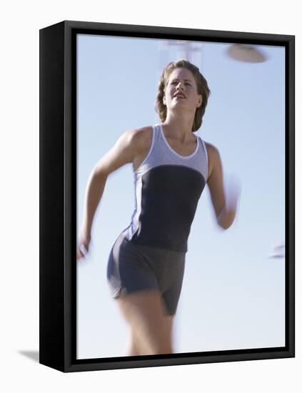 Low Angle View of a Woman Running-null-Framed Premier Image Canvas