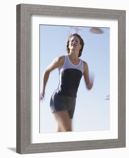 Low Angle View of a Woman Running-null-Framed Photographic Print