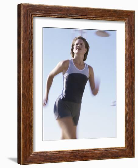 Low Angle View of a Woman Running-null-Framed Photographic Print