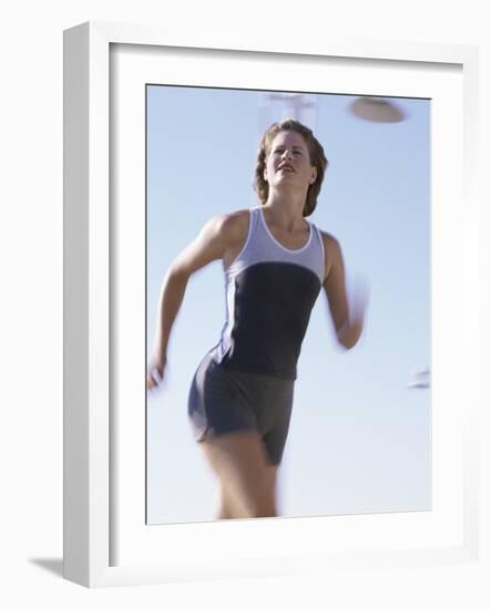 Low Angle View of a Woman Running-null-Framed Photographic Print