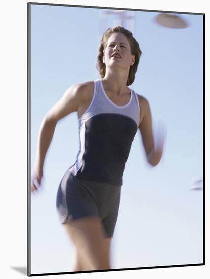 Low Angle View of a Woman Running-null-Mounted Photographic Print