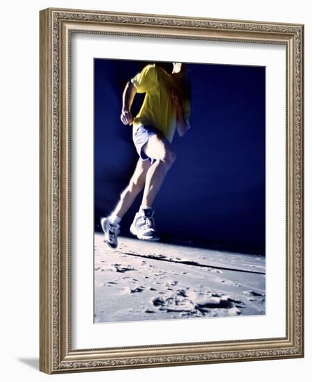 Low Angle View of a Young Man Running on the Beach-null-Framed Photographic Print