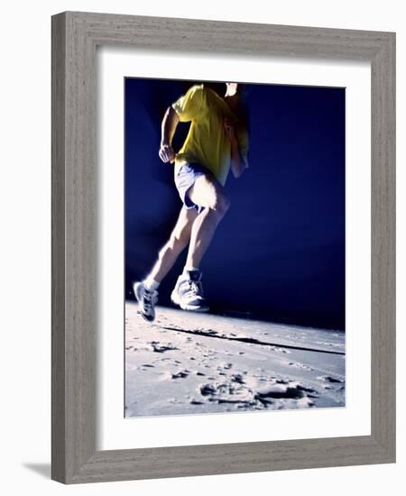 Low Angle View of a Young Man Running on the Beach-null-Framed Photographic Print