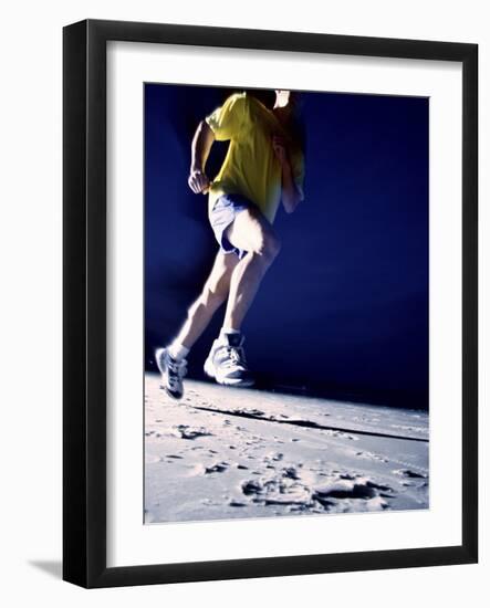 Low Angle View of a Young Man Running on the Beach-null-Framed Photographic Print