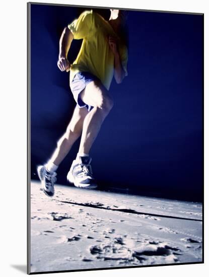 Low Angle View of a Young Man Running on the Beach-null-Mounted Photographic Print