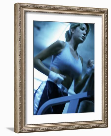 Low Angle View of a Young Woman Running on a Treadmill-null-Framed Photographic Print