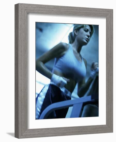 Low Angle View of a Young Woman Running on a Treadmill-null-Framed Photographic Print