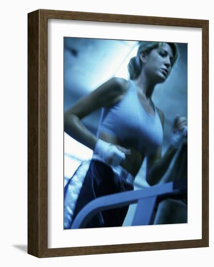 Low Angle View of a Young Woman Running on a Treadmill-null-Framed Photographic Print