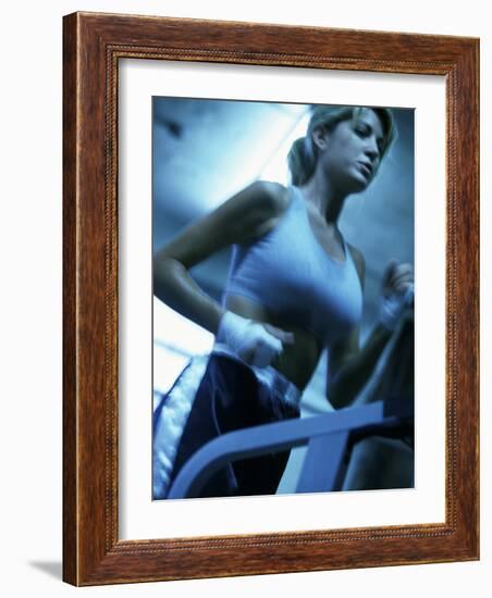 Low Angle View of a Young Woman Running on a Treadmill-null-Framed Photographic Print