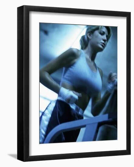 Low Angle View of a Young Woman Running on a Treadmill-null-Framed Photographic Print