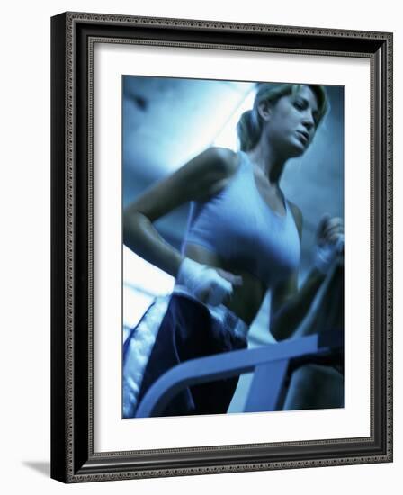 Low Angle View of a Young Woman Running on a Treadmill-null-Framed Photographic Print