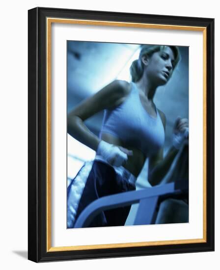 Low Angle View of a Young Woman Running on a Treadmill-null-Framed Photographic Print