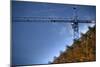 Low Angle View of Crane on Construction Site-David Barbour-Mounted Photo