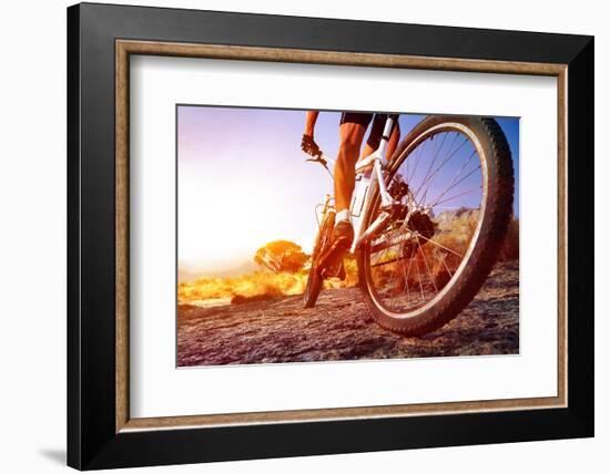 Low Angle View Of Cyclist Riding Mountain Bike On Rocky Trail At Sunrise-warrengoldswain-Framed Photographic Print