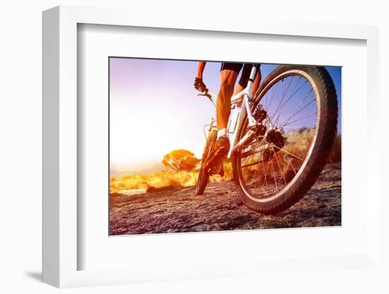 Low Angle View Of Cyclist Riding Mountain Bike On Rocky Trail At Sunrise-warrengoldswain-Framed Photographic Print