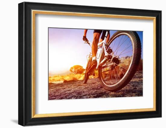 Low Angle View Of Cyclist Riding Mountain Bike On Rocky Trail At Sunrise-warrengoldswain-Framed Photographic Print