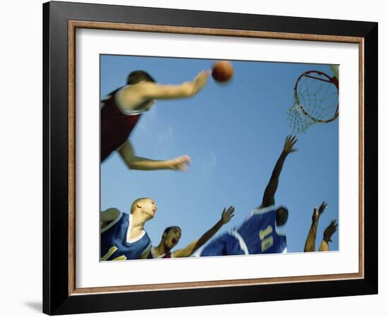 Low Angle View of Group of Young Men Playing Basketball-null-Framed Photographic Print