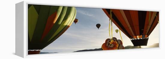 Low angle view of hot air balloons in a balloon festival, Taos Balloon Fiesta, Taos, Taos County...-null-Framed Premier Image Canvas