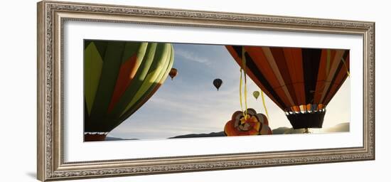 Low angle view of hot air balloons in a balloon festival, Taos Balloon Fiesta, Taos, Taos County...-null-Framed Photographic Print