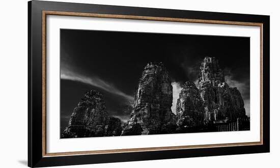 Low angle view of ruins of carved stone faces in temple, Serenity of the Stone Faces, Prasat Bay...-Panoramic Images-Framed Photographic Print