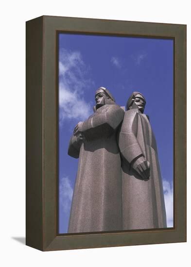 Low Angle View of Two Statues, Red Latvian Riflemen, Riga, Latvia-null-Framed Premier Image Canvas