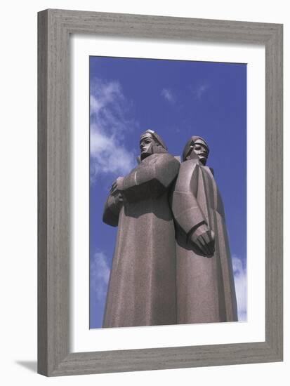 Low Angle View of Two Statues, Red Latvian Riflemen, Riga, Latvia-null-Framed Giclee Print