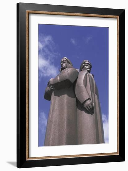 Low Angle View of Two Statues, Red Latvian Riflemen, Riga, Latvia-null-Framed Giclee Print