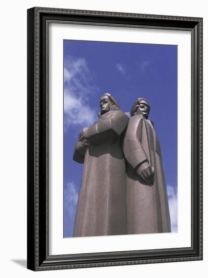 Low Angle View of Two Statues, Red Latvian Riflemen, Riga, Latvia-null-Framed Giclee Print