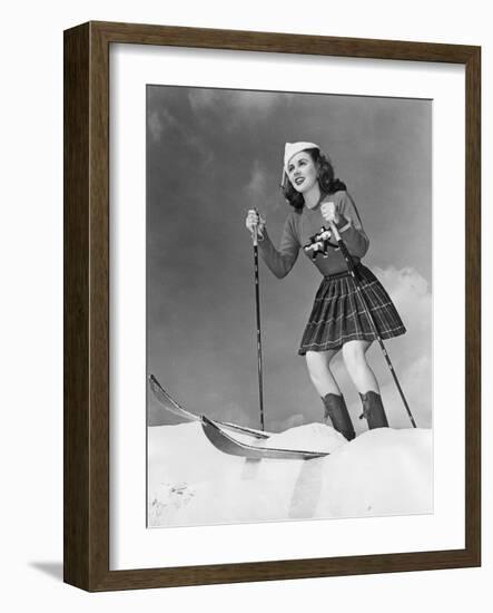 Low Angle View of Young Woman Skiing-null-Framed Photo
