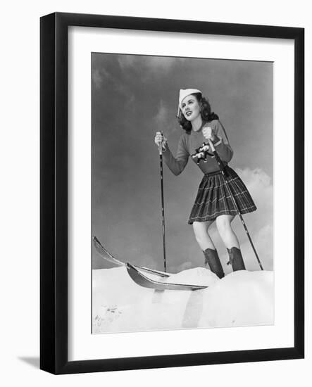 Low Angle View of Young Woman Skiing-null-Framed Photo