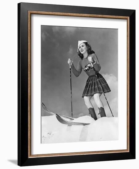 Low Angle View of Young Woman Skiing-null-Framed Photo