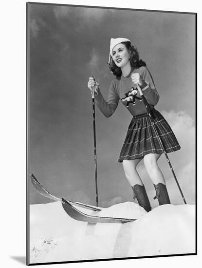 Low Angle View of Young Woman Skiing-null-Mounted Photo