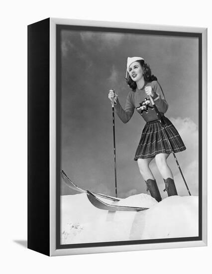 Low Angle View of Young Woman Skiing-null-Framed Stretched Canvas