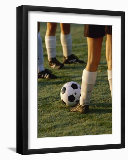 Low Section View of Soccer Players Feet and a Soccer Ball-null-Framed Photographic Print