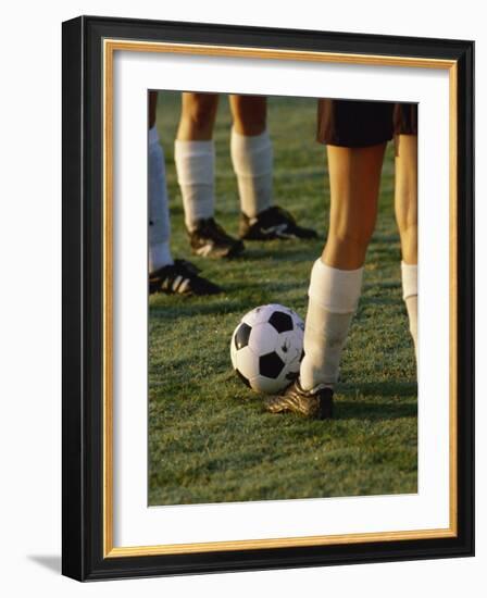 Low Section View of Soccer Players Feet and a Soccer Ball-null-Framed Photographic Print