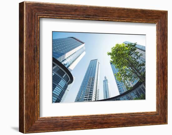 Low Wide Angle View of a Group of New Skyscrapers Combined with Fresh Greenery in Jianggan-Andreas Brandl-Framed Photographic Print