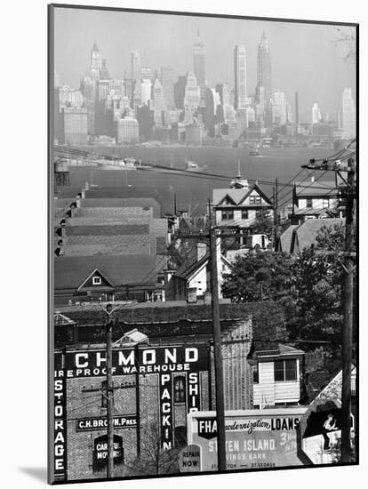 Lower Manhattan and Ferry Docks with Aid of a Telephoto Lens over the Rooftops in Staten Island-Andreas Feininger-Mounted Photographic Print