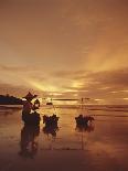 Woman with lamp and baskets on the beach, Phuket, Thailand-Luca Tettoni-Photographic Print