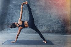 Woman Practicing Yoga in a Urban Background (Side Plank Pose, Vasisthasana)-Luna Vandoorne-Framed Photographic Print