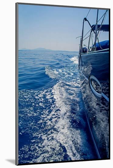 Luxury Navy Blue Sail Yacht is Sailing on High Speed in a Blue Sea with Waves Reflected in a Smooth-Artem Avetisyan-Mounted Photographic Print