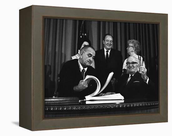 Lyndon Johnson Signing the Medicare Bill with Former President Truman, July 7,1965-null-Framed Stretched Canvas