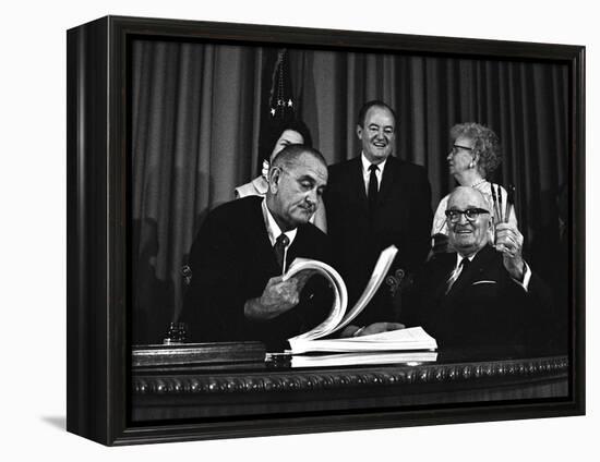 Lyndon Johnson Signing the Medicare Bill with Former President Truman, July 7,1965-null-Framed Stretched Canvas