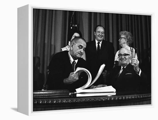 Lyndon Johnson Signing the Medicare Bill with Former President Truman, July 7,1965-null-Framed Stretched Canvas