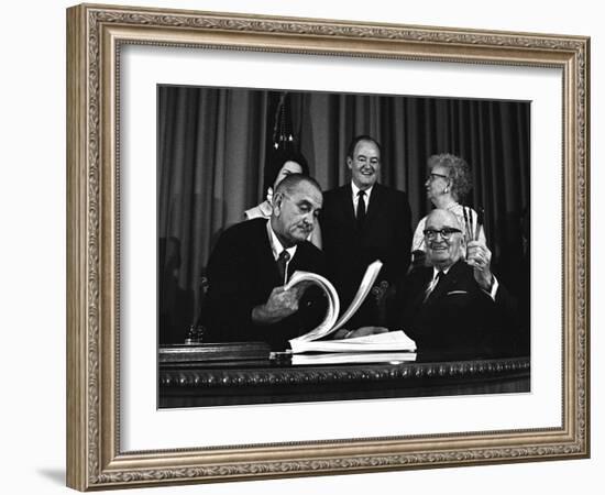 Lyndon Johnson Signing the Medicare Bill with Former President Truman, July 7,1965-null-Framed Photo