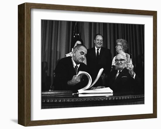 Lyndon Johnson Signing the Medicare Bill with Former President Truman, July 7,1965-null-Framed Photo