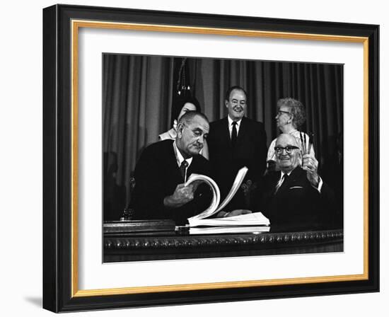 Lyndon Johnson Signing the Medicare Bill with Former President Truman, July 7,1965-null-Framed Photo